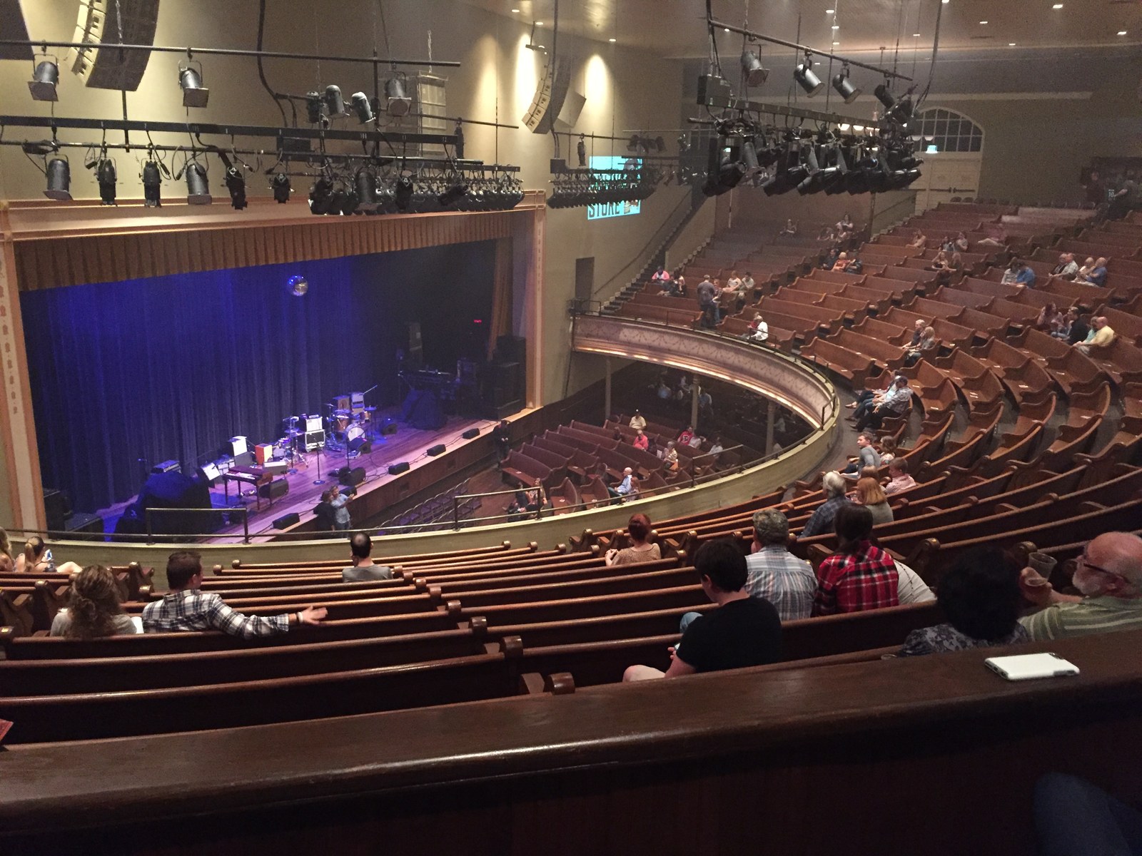 The stage and seating of Ryman Auditorium seen from an upper balcony before a 2015 performance.